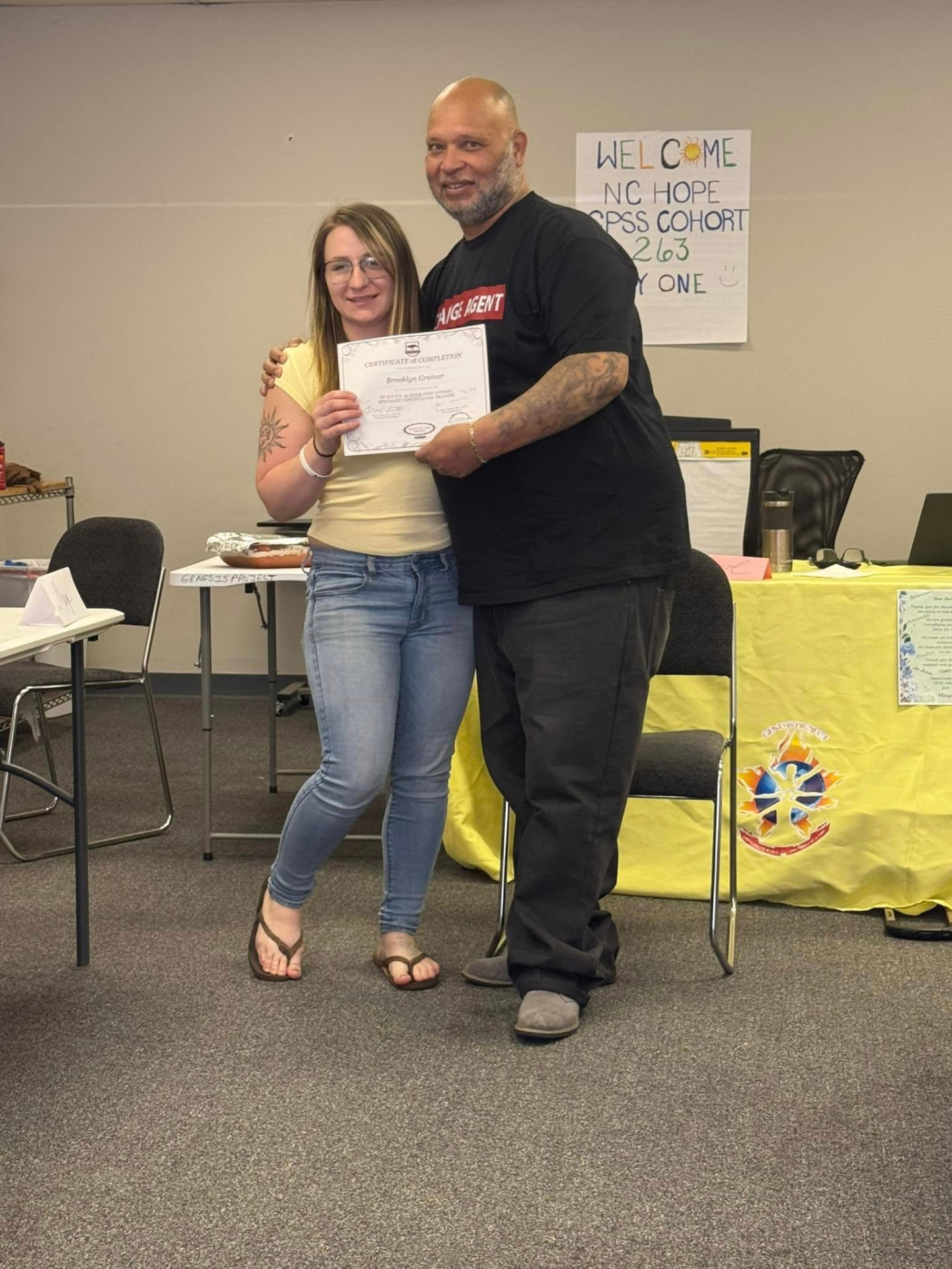 Earl Owens III congratulating a peer support training graduate